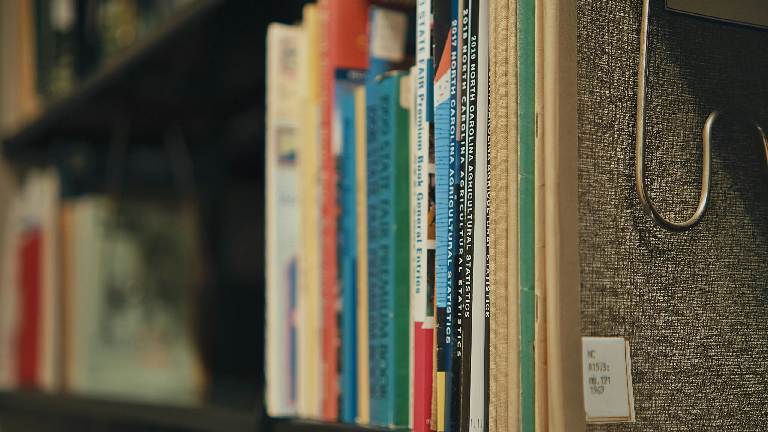 Shelf filled with books and documents, symbolizing heavy content that needs optimisation to improve page load speed and reduce bounce rate.